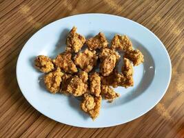 Crispy Fried Chicken Bites on a White Plate, Asian Snacks Side Dishes photo