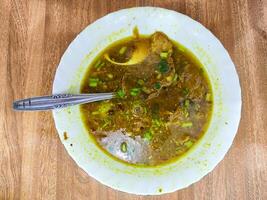 Soto Madura, Indonesian Beef Soup with Hearty Spices and Herbs photo