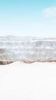 snowy mountains with deep ravine and rock cliffs video