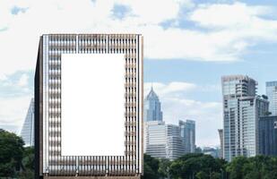 Mock up white vertical large LED display billboard on tower building with cityscape background .Clipping path for mockup photo