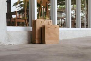 Package of paper bags lying in front of the house photo