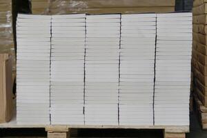 Stacks of books after going through printing production in the offset industry. Pile of books ready to enter the finishing stage of lamination photo