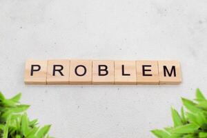 Top view of Problem word on wooden cube letter block on white background. Business concept photo