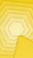 A yellow background with a large hexagon shape video