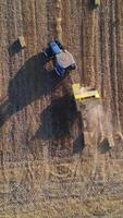 An aerial view of a combine harvester in the field video