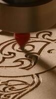 Sawing patterns on a polished board. Creative. With the help of a special jigsaw, the patterns of the master are drawn. video