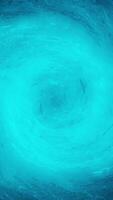 Abstract blue water tornado, view from the top of the vortex on dark background. Abstract water swirl flowing, seamless loop. video