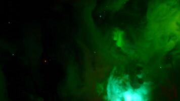 Cosmic Colorful Nebula. Design. Moving colorful fog in outer space. Colorful nebula of space in beautiful stream on black background video