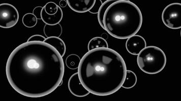 Black background. Design. Large white bubbles in animation on a dark background scatter in different directions. video