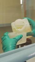Work in the laboratory. Clip. The job of a chemist who pours liquid and checks it video