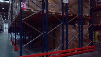 Huge boxes in the warehouse. Creative. Sealed boxes in a huge large warehouse where things are stored. video