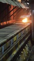Smelting works at old factory. Scene. On old dirty workshop is carried out melting operation with controlled fire. Working with fire for metal alloy in factory video