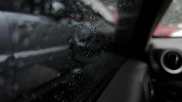 Rain droplets sliding down the glass create a cozy and tranquil ambiance, while the reflections intensify the effect. video