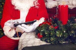 Santa Claus using a tablet computer photo