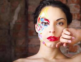 Portrait of a beautiful young model with bright make up photo