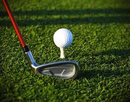 Golf ball on tee and driver photo