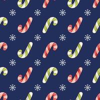Christmas seamless pattern with red and green candy cane cane on dark blue background with snowflakes vector