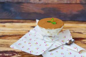 Tiramisu in a glass cup photo