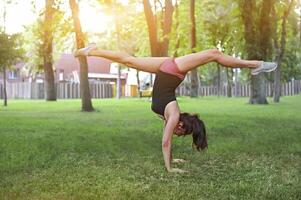 Stretching woman in outdoor exercise smiling happy doing stretches photo