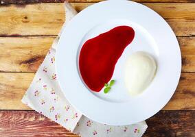 Panna cotta Italian dessert with raspberry sirup photo