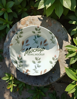 Plate mockup with leaf and stone background psd