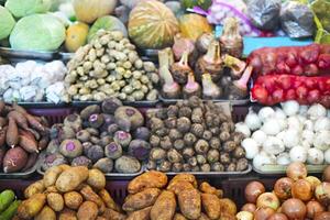 Vegetables and fruits at open air market photo