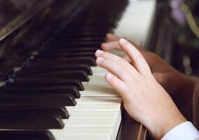 Child playing the piano photo