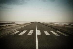 Empty dark road near the CHOTT EL JERID photo