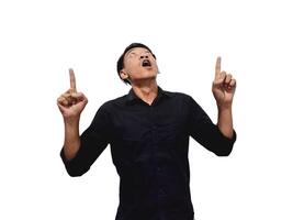 Shocked young Asian man in casual shirt pointing finger aside at copy space isolated on white background. Great offer concept photo