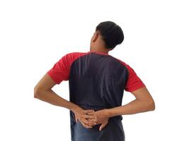 Lower back pain is usually caused by a muscle injury. broken pillow.Isolated on white background photo