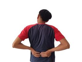 Lower back pain is usually caused by a muscle injury. broken pillow.Isolated on white background photo