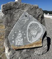 A stone with a picture of jesus on it photo