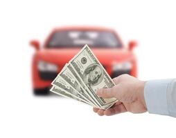 Hand holding money and car on white background photo