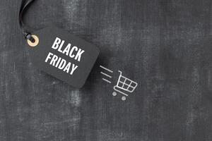 Sale tag with Black Friday written on blackboard photo