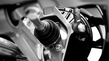 Car suspension and drive shaft. Structure of EV car spare parts. Such as Front or Rear suspension Shock absorber suspension Brake. Elements of the suspension and Chassis structure. Car service repair. photo