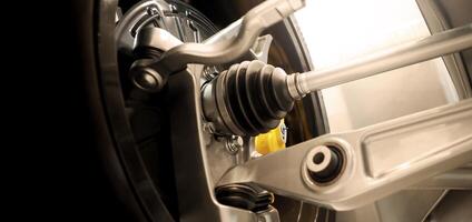 Car suspension and drive shaft. Structure of EV car spare parts. Such as Front or Rear suspension Shock absorber suspension Brake. Elements of the suspension and Chassis structure. Car service repair. photo