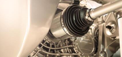 Car suspension and drive shaft. Structure of EV car spare parts. Such as Front or Rear suspension Shock absorber suspension Brake. Elements of the suspension and Chassis structure. Car service repair. photo