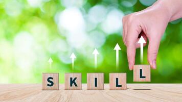 Skill training, Personal development and promoted employee, education, learning, ability, Upskilling and personal development concept, Upskilling, reskilling, new skills on wooden cube. photo