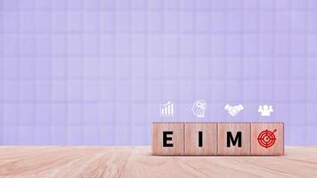 EIM Enterprise information management system on wooden cubes, EIM Global Network with Analyzing Technological Data, Efficient Information Management. photo