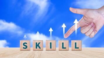 Skill training, Personal development and promoted employee, education, learning, ability, Upskilling and personal development concept, Upskilling, reskilling, new skills on wooden cube. photo