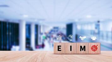 EIM Enterprise information management system on wooden cubes, EIM Global Network with Analyzing Technological Data, Efficient Information Management. photo