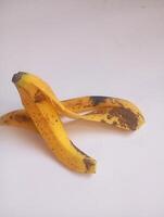 A photo of a banana peel styled in isolation with space for text.