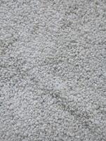 Photo of a textured background made of many small white stones