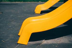 Roller coaster at the children's playground, yellow slide photo