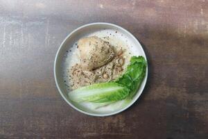 grilled chicken or chicken steak or baked chicken with garlic , mushroom and lettuce photo