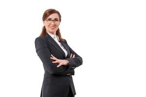 Portrait of a beautiful businesswoman 50 ears old in crossed arms pose isolated on white. photo