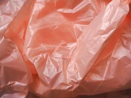 Old rose colored plastic bag texture for abstract background. photo
