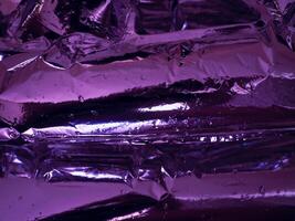 Plastic texture in dark purple light at night for abstract background photo