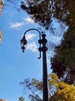 a street lamp with a blue sky in the background photo