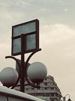 a street light with a sign on it photo